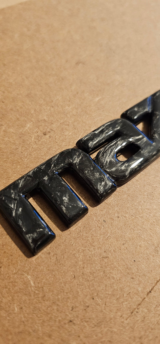 Forged carbon Mazda badge rear