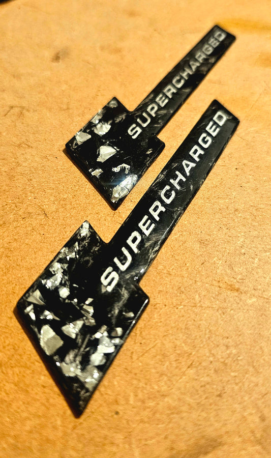 Forged carbon Audi supercharged wing badges pair