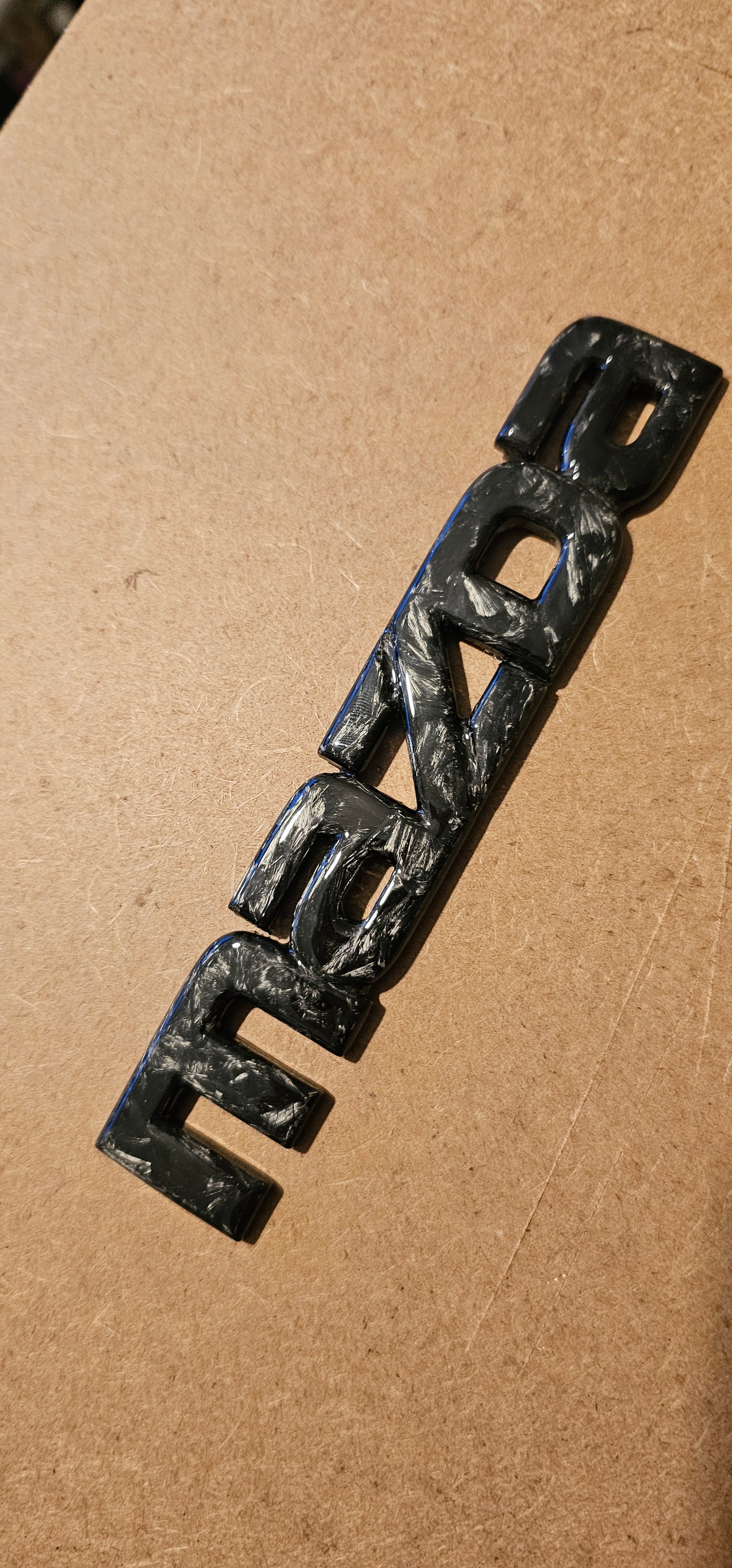 Forged carbon Mazda badge rear