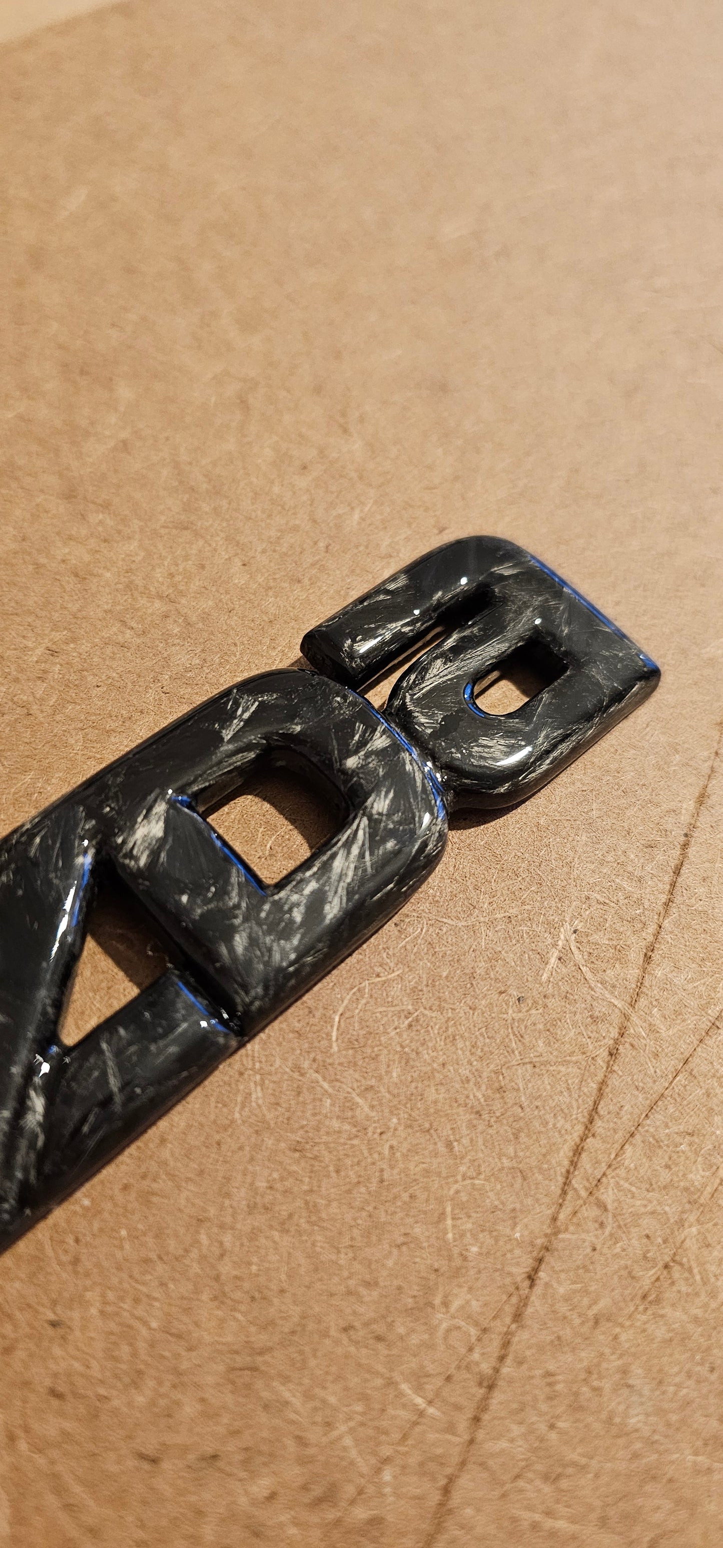 Forged carbon Mazda badge rear