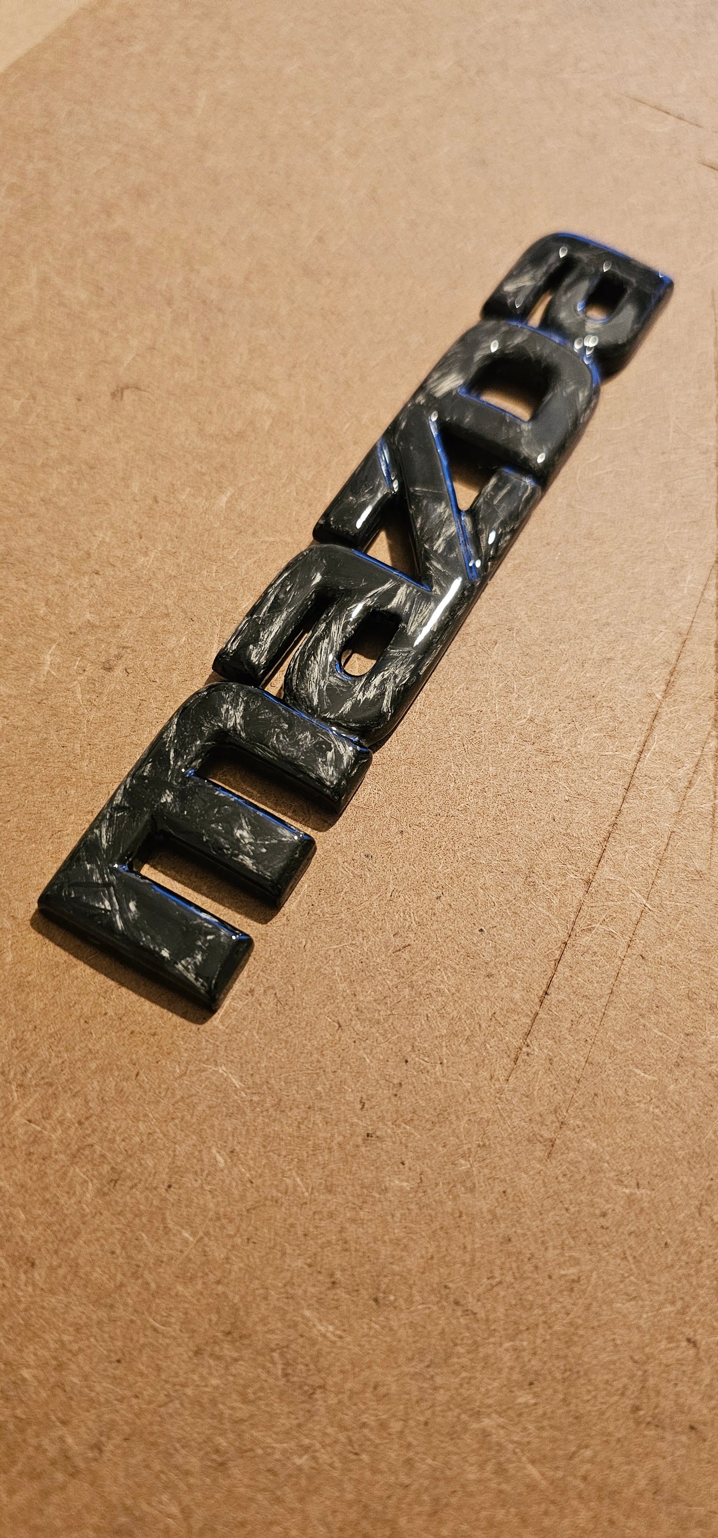 Forged carbon Mazda badge rear